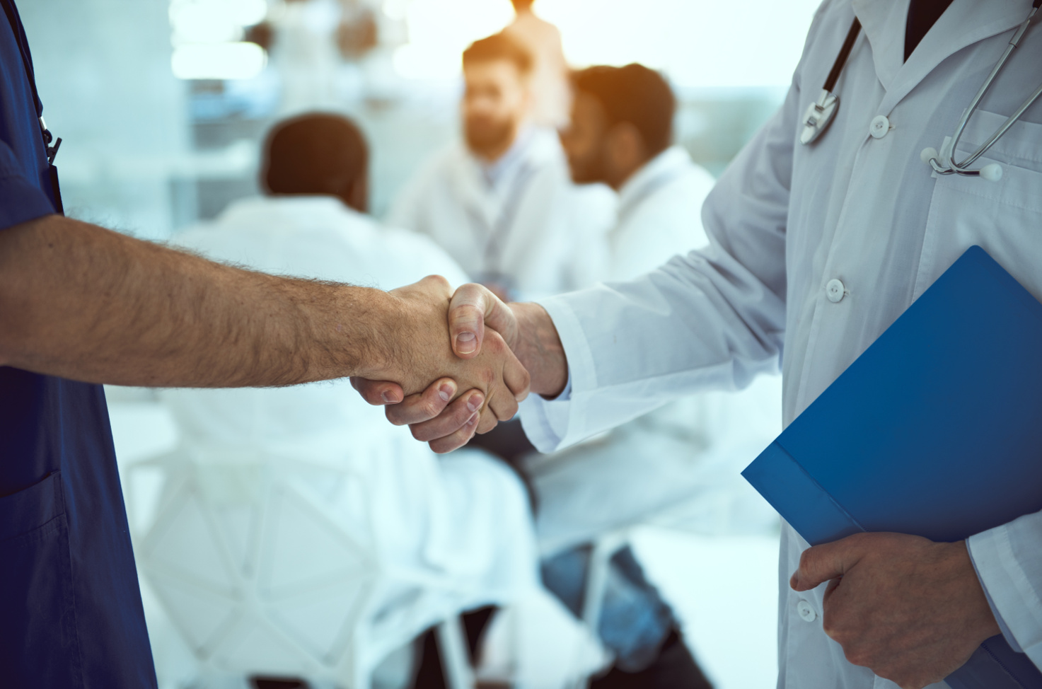 Close up of handshake of two doctors stock photo